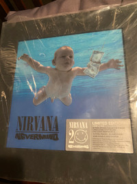 Sealed NIRVANA-limited edition nevermind cds, book and dvd 