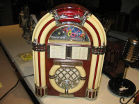 JUKEBOX- TABLE TOP- SIZE IN AD. LIGHTS- WORKS.