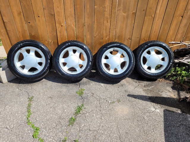 Ford mustang rims with 205 60 15 Goodyear winter tires.  in Tires & Rims in Cambridge