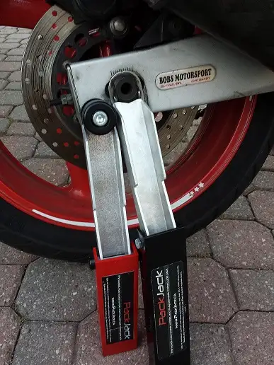 FS new portable motorcycle jack stand for clean and lube your chain. motorcycle owner should clean a...