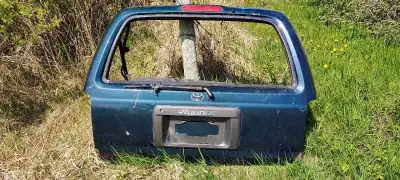 Selling a used Toyota 4Runner rear hatch door, with the glass inside it. Not sure what year it's fro...