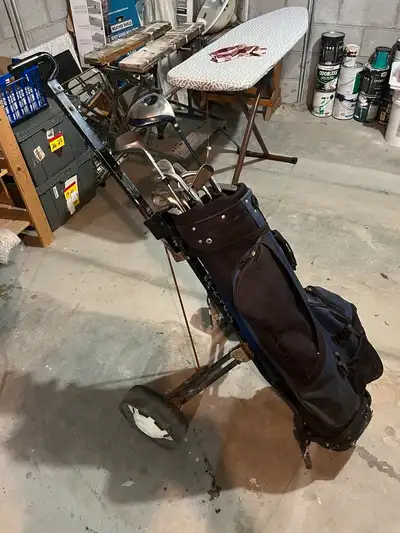 Set of golf clubs with cart