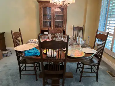 Antique oak set Table has added capacity and comes with 6 chairs and hutch