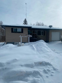 Single family house on 9.98 acres backs to the Miquelon lake.