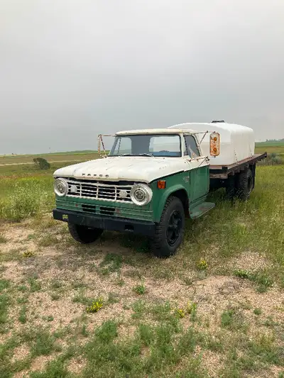 1965 Fargo 600 flat deck truck . Comes with 1325 gallon water tank. $2200.00 OBO