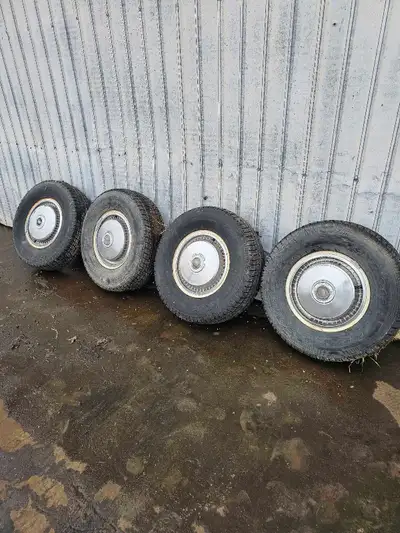 I am selling a set of four used tires, with rims and hubcaps included. 5 bolt rims not sure what pat...