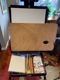 Easel , brushes , paints and canvases 