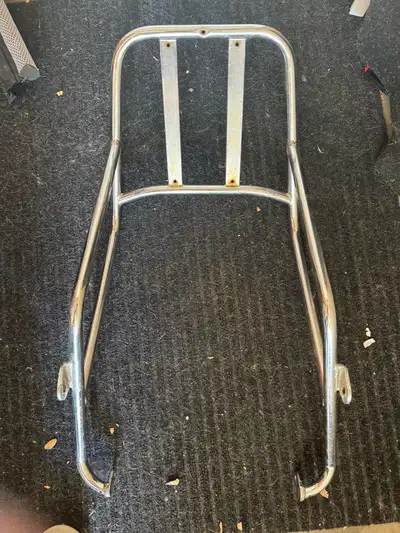 This chrome motorcycle rack came off of a 1982 Honda CB400T Hawk. It might fit other years/models, b...