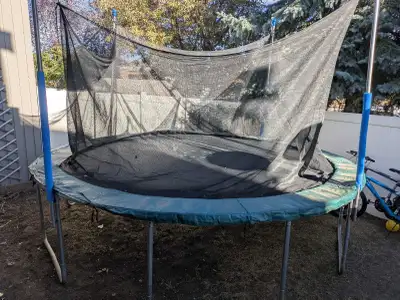 Get ready to bounce with this 12-foot trampoline, complete with a safety net for worry-free fun! Whi...