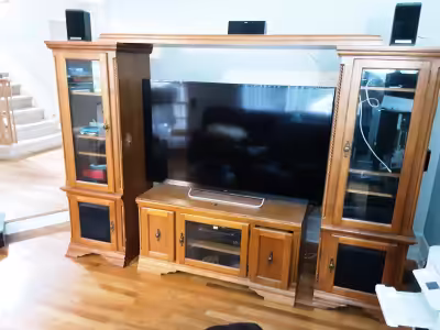 Selling ONLY the tv wall unit. can accommodate large size TVs. (TV shown on picture is 65 inch)