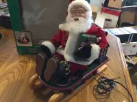 Animated Santa on Sled,plays Christmas Carols