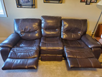 Brown genuine leather reclining sofa and loveseat.