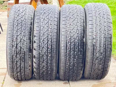 Selling a set of four Firestone Destination LE2 all-season tires, size 225/65R17, with only 2000 kil...