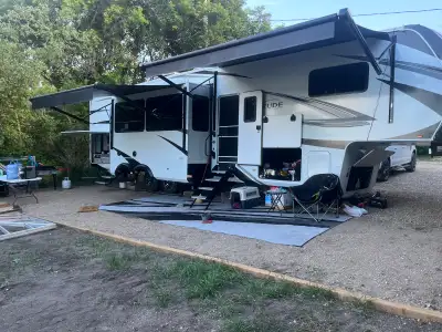 2023 Fifth Wheel Grand Design Solitude 378BHS Has rear bunk house with fold out couch and 4 bunks. H...