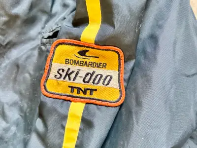 I'm selling my vintage Ski-doo TNT snowmobile suit, perfect for collectors or those looking for a re...