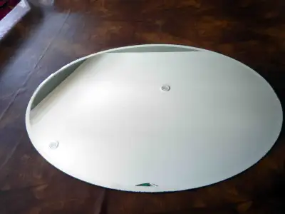 Oval Mirror 30" x 22". A few blemishes, includes mounting hardware.