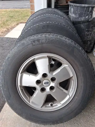 4 Michelin Tires - 235 70R16 Alloy rims - 5x114.3 Will fit 2001 to 2012 Ford Escape Good for 1 more...