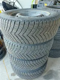 A Set of Winter Tires and Rims - 215 60 R16