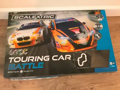 New condition - used less than a few hours. 1:32 scale. Set, extra track and cars all purchased at M...