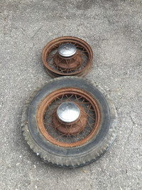 4 1934 Ford rims and 3 tires and 5 hubcaps