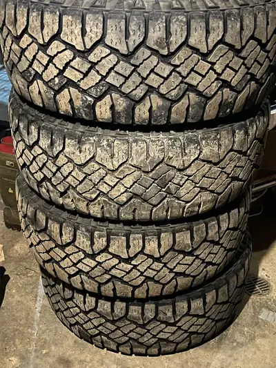 275/55/20. Goodyear duratrac. About 1/4” of tread