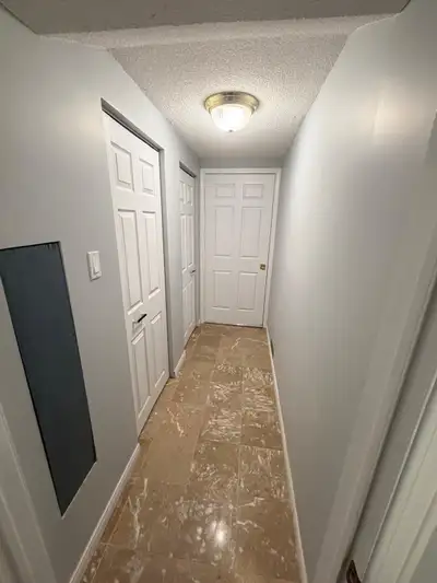 This spacious rental basement features a well-lit interior and tile and wood flooring throughout. Of...