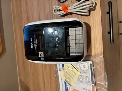 Brand new label printer with label cartridges, all of the cables, all of the instructions. Paid $130...