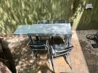 Bistro table with four chairs for outdoor dining