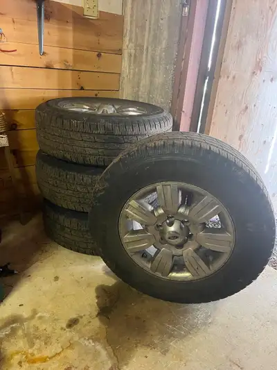 265/70 R 18 tires and rims. Tires used just over one season.