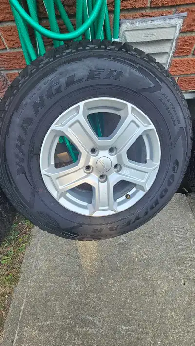 5 AT Goodyear wrangler 'kevlar' tires on rims for Jeep Wrangler ..245 / 75 R 17 one is Brand new wit...