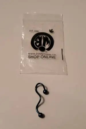 New not used. This is a surgical steel belly button naval barbell ring. Gilttery blue color. Pickup...