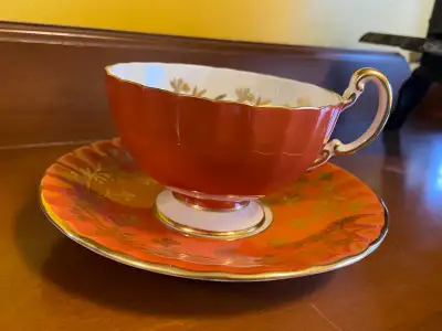 Vtg. Aynsley England Orange Gold Thistle Bone China Tea Cup & Saucer. It is a vibrant orange with go...