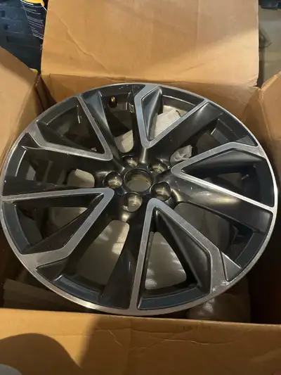 Selling one used Toyota Corolla rim, featuring a stylish machined face on black painted spokes. This...