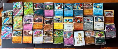 Selling over 5000 random Pokémon cards. Cards feature a mix of Pokémon with various abilities, types...