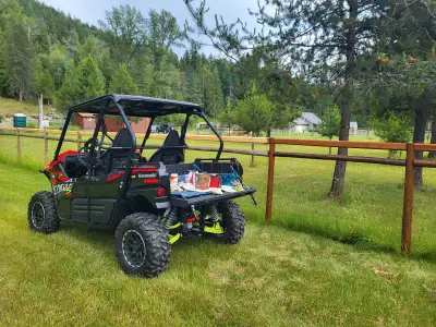 2023 kawasaki 800 S side by side 4x4 two seater with cargo box and huge storage compartments behind...