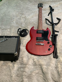 Almost new epiphone guitar comes with an amplifier and a stand