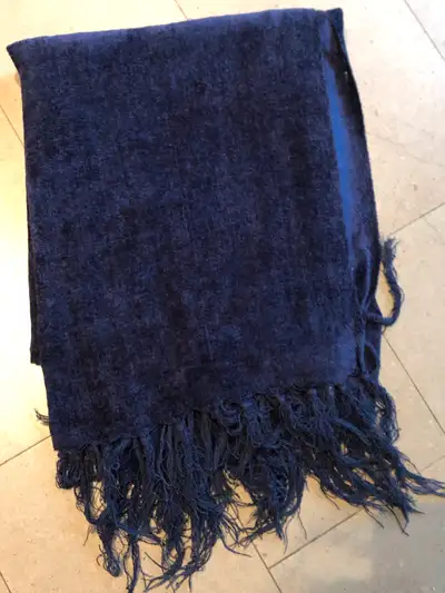 Selling a gently used rich blue blanket/throw. It is a thin chenille knit fabric with fringes. Great...