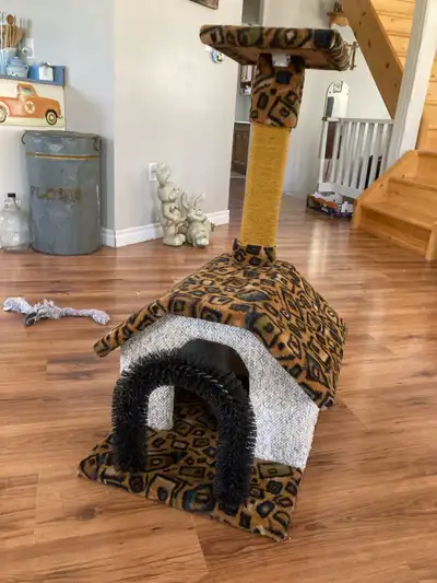 This is a gently used cat scratcher, house, and climber combo, perfect for your feline friend! It fe...