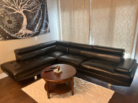 Two-piece black leather sectional couch