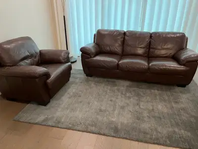 Upgrade your living space with this comfortable pre-owned sofa and matching armchair set. Both piece...