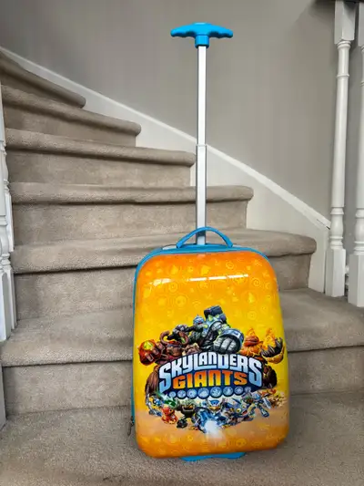 Gently used kids Skylanders luggage carry on $35 18x8.5x20” - 6 lbs spinner toddler luggage