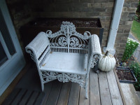Antique wicker chair, wide seat.