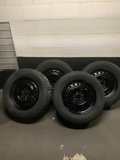 4 winter tires mounted on black painted rims for a fresh look, no structural damage. Size 225/65R17...
