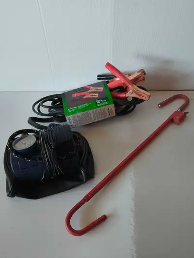 This used car protection kit includes booster cables, a tire inflator, and a lockout kit, all essent...