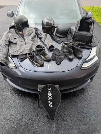 This pre-owned motorcycle riding gear bundle includes a stylish gray textile riding jacket, two half...