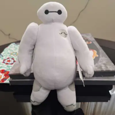 Big Hero 6 Baymax Plush The arms are movable. About 9.5 inches. Comes from a pet free and smoke free...