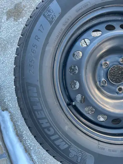 I'm selling a set of Michelin X-Ice winter tires, size 235/65 R17, mounted on rims, perfect for a 20...