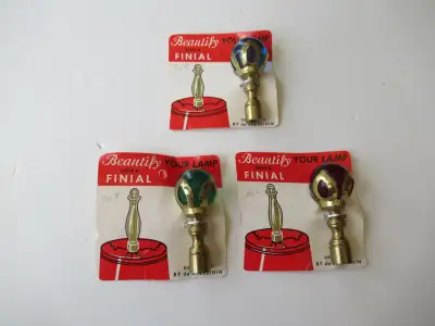 C. 1940's new old stock lamp finials. One green glass. One blue glass. Has a couple of tiny surface...