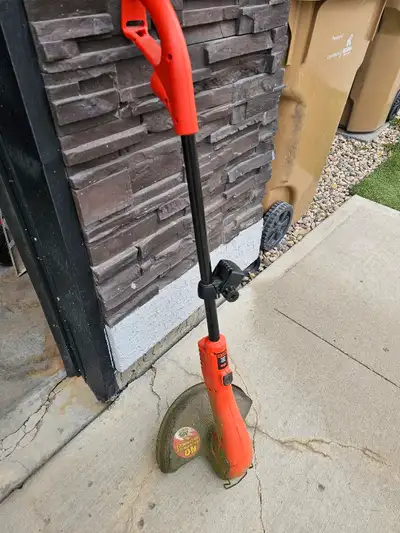 Black and Decker Grasshog weed and grass trimmer. In working condition. If listing is up it's still...
