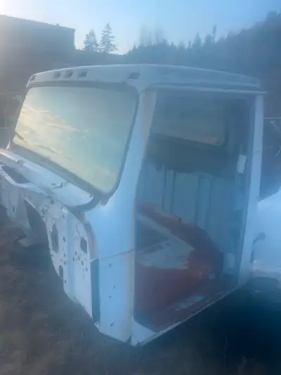 Bare cab from an international truck $500 had DT 466, one bad spot on driver inside corner as pictur...